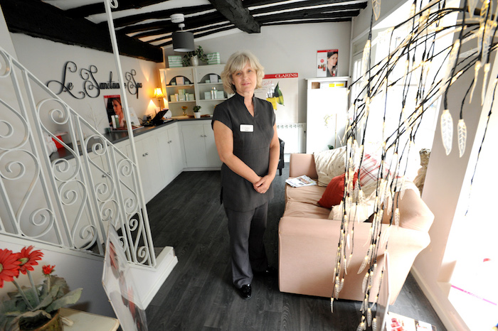 Lady stood in the reception area of Le Sanctuaire Spa