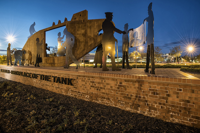 Tank sculpture on brick plinth