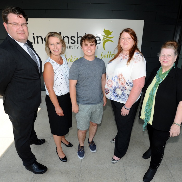 5 people stood in front of Lincolnshire County Council sign