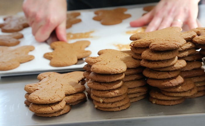 Gingerbread men biscuits on a baking tray