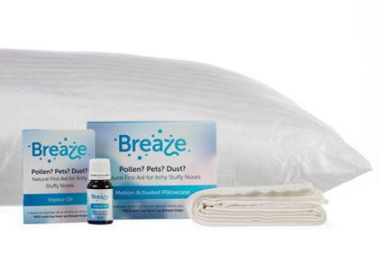 Breaze tablets in front of pillow