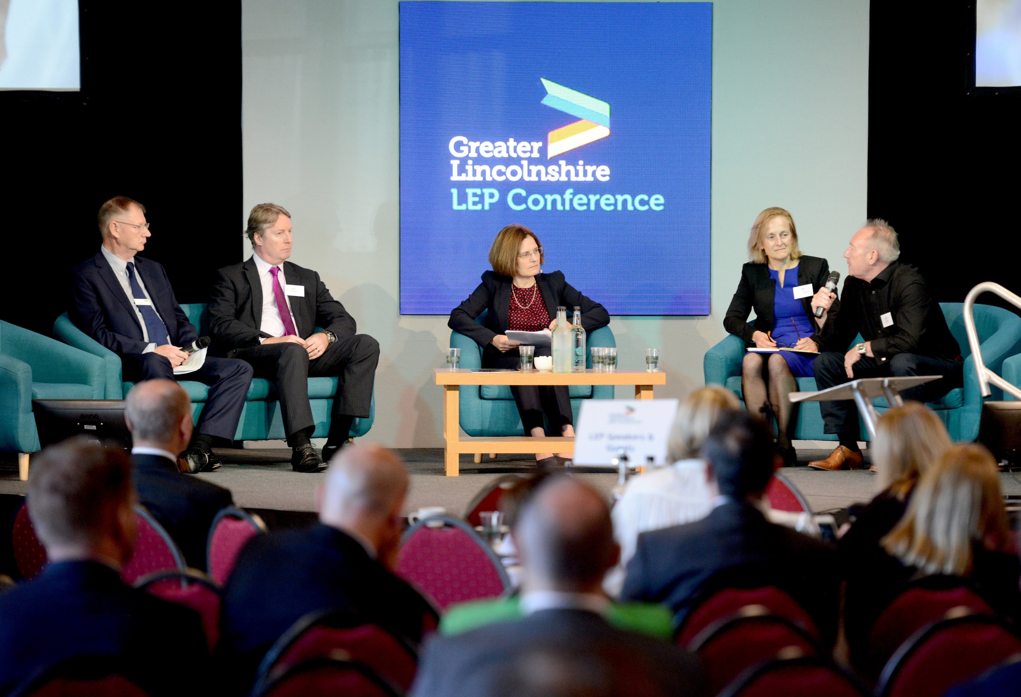 Large group of people sat down at an event listening to a Greater Lincolnshire LEP Conference Panel presentation