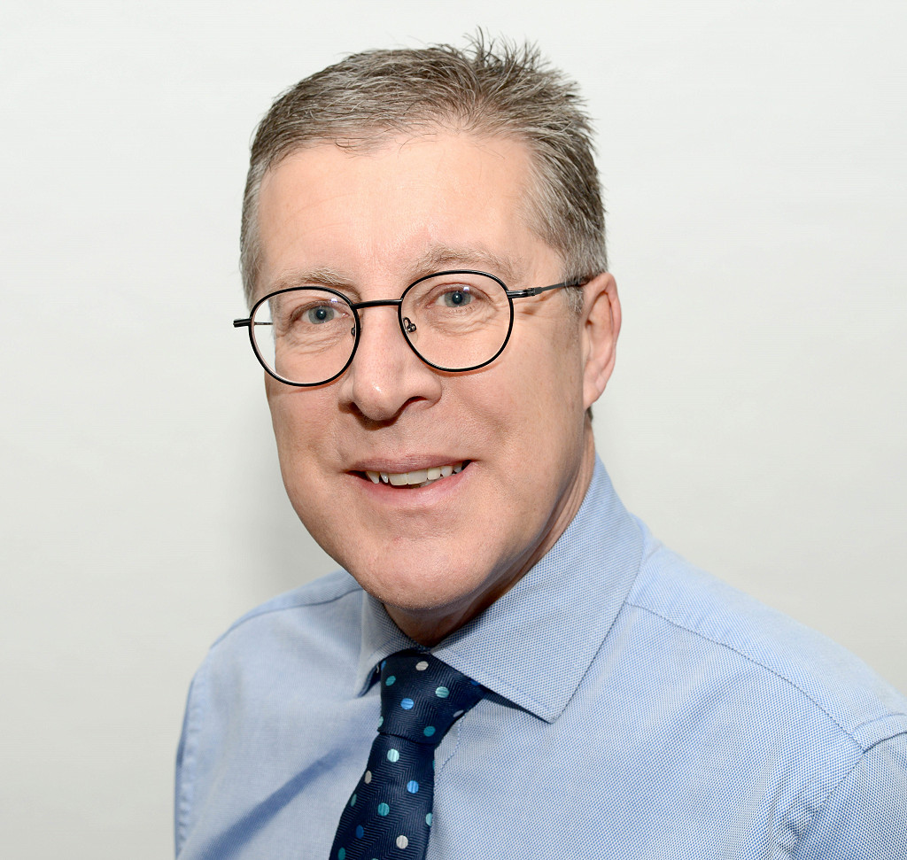 Head shot of gentleman stood in smart clothes