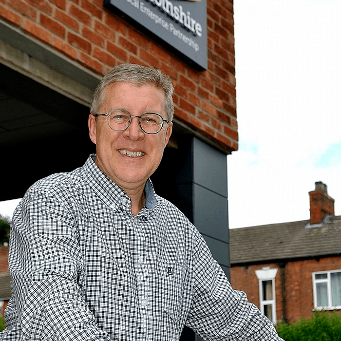 Image of gentleman stood in smart clothes