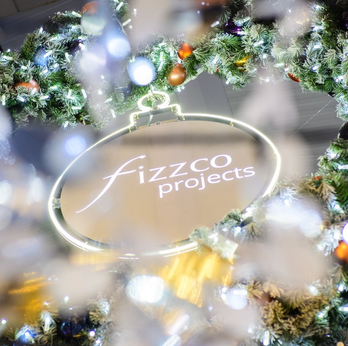 Fizzco logo surrounded by Christmas decor