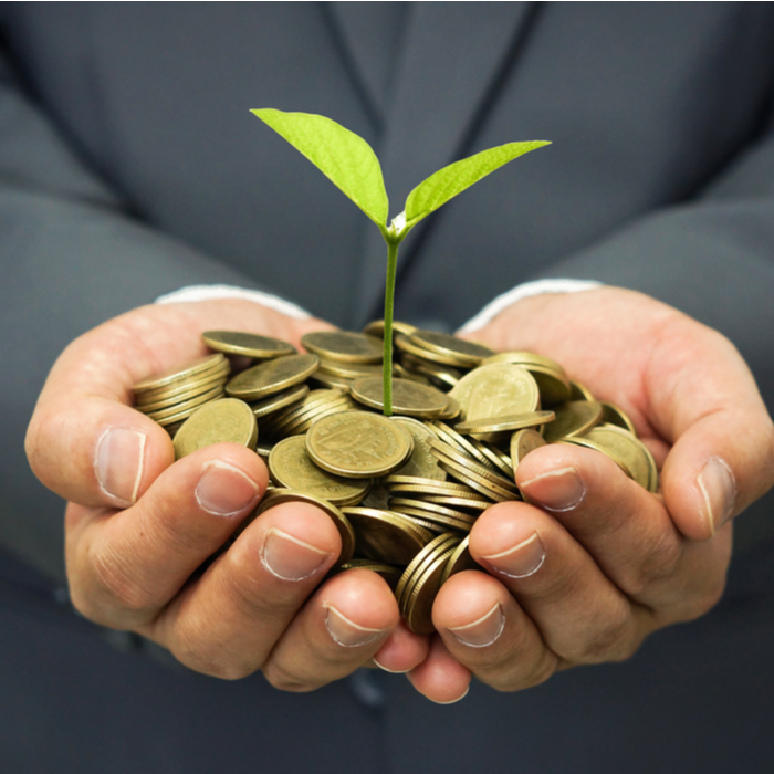 Man with coins and plant