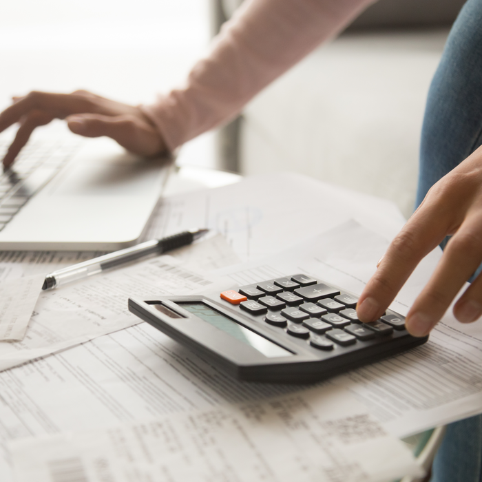 woman using calculator