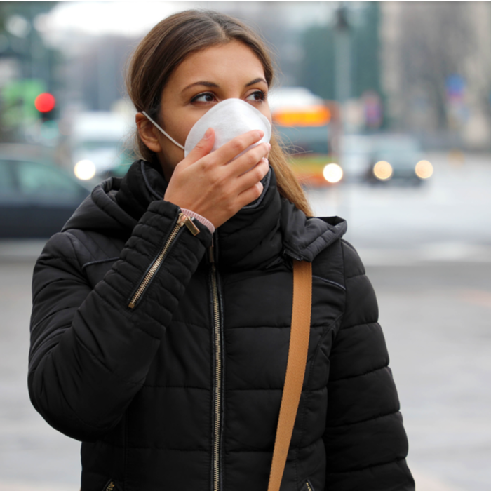 Woman wearing a face covering mask