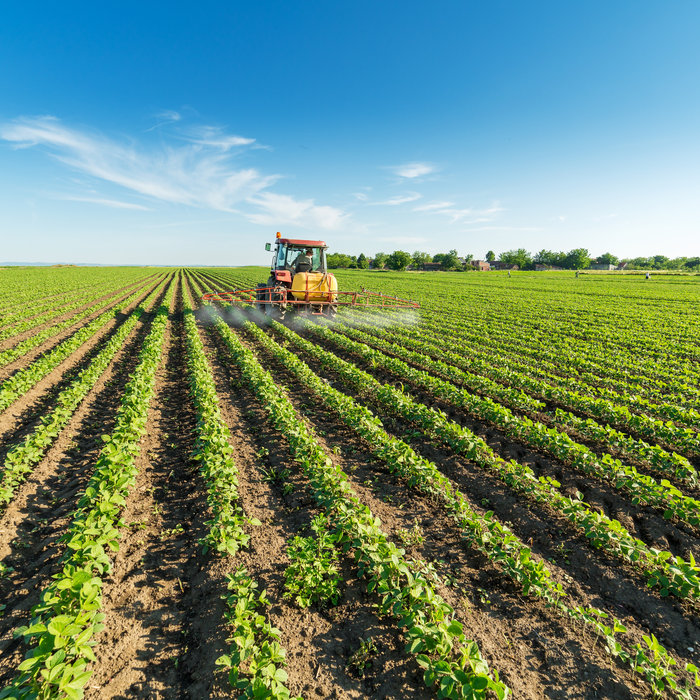 Farmer spraying field of crops - Application window for 2022 farm payments is now open - Business Lincolnshire