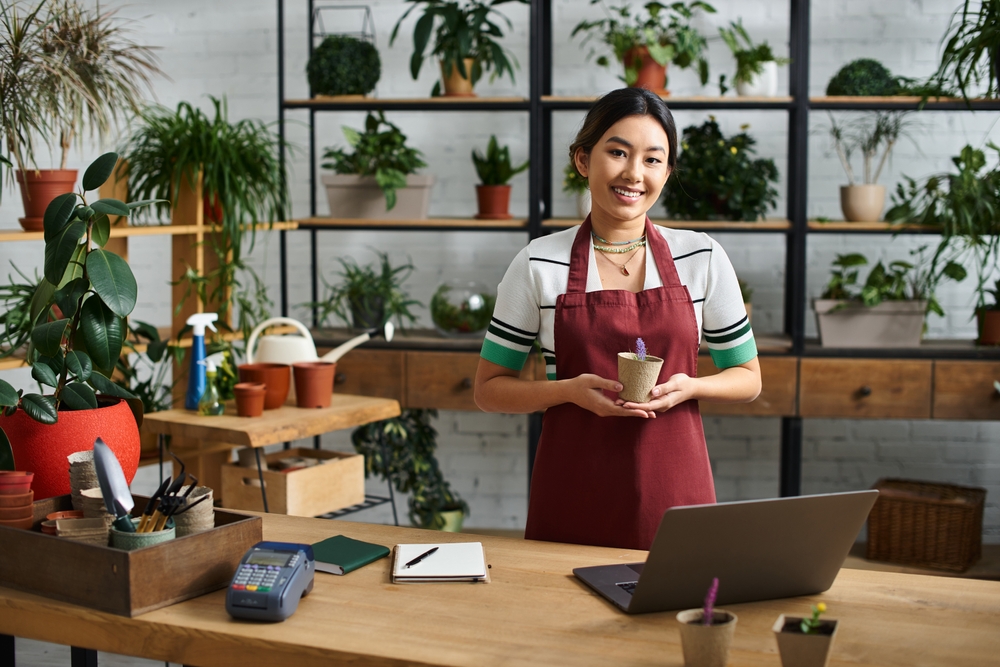 An,Asian,Woman,,The,Owner,Of,A,Plant,Store,,Smiles