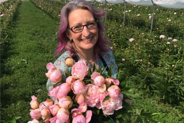 Founded, Helen Chambers holding flowers