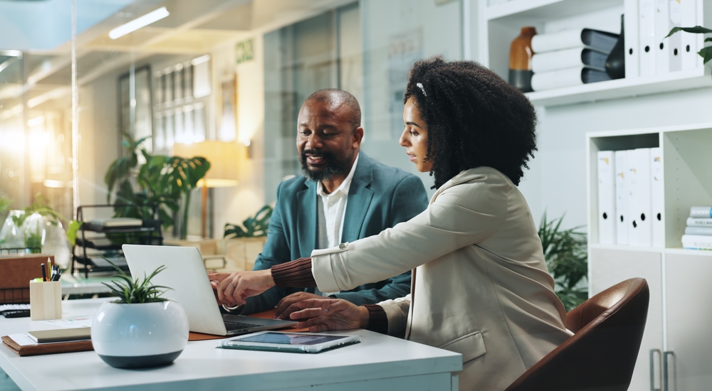 Laptop, business people and team planning in office.
